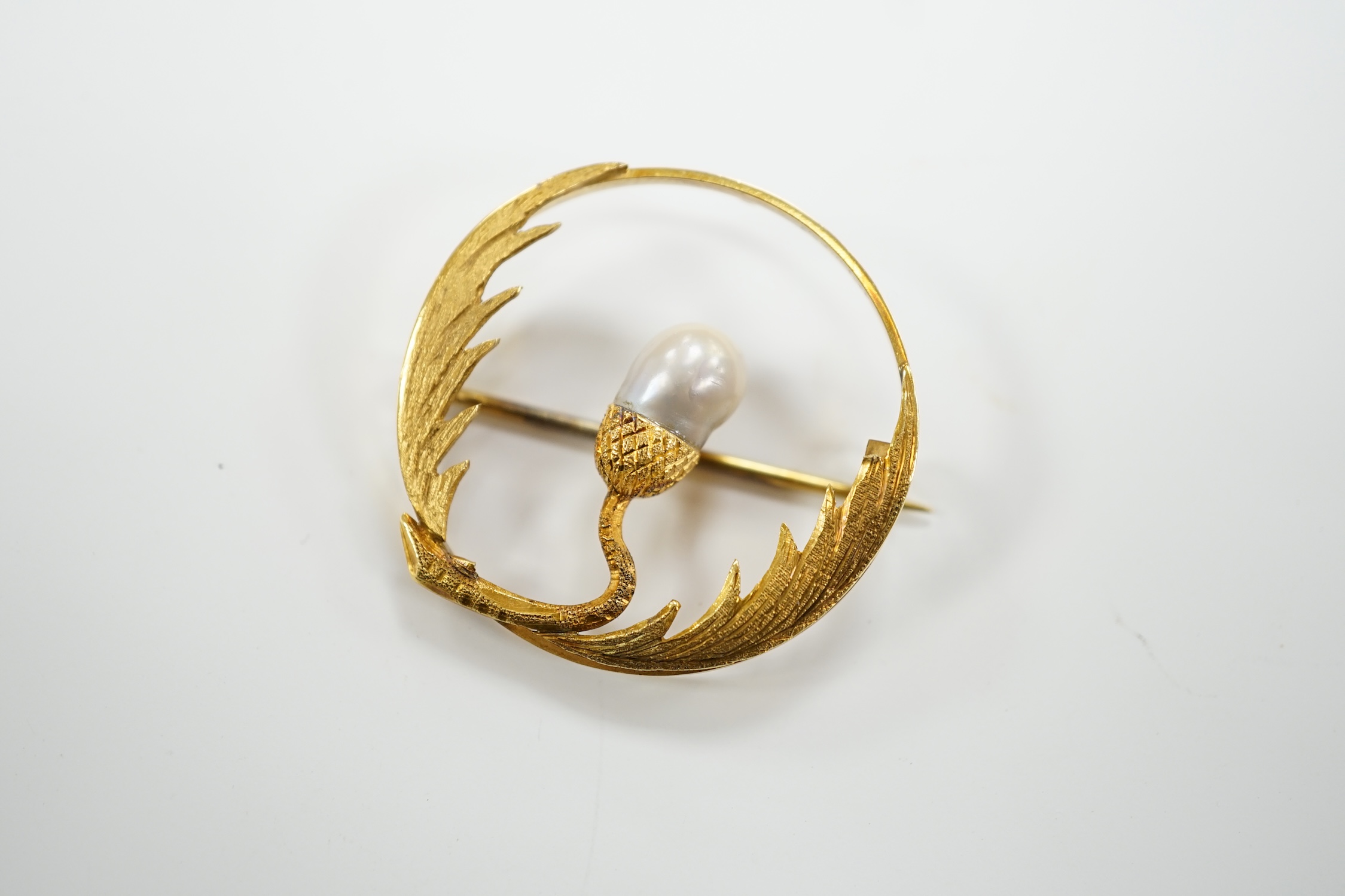 A late Victorian 15ct and baroque pearl set open work thistle brooch, 34mm, gross weight 6.1 grams.